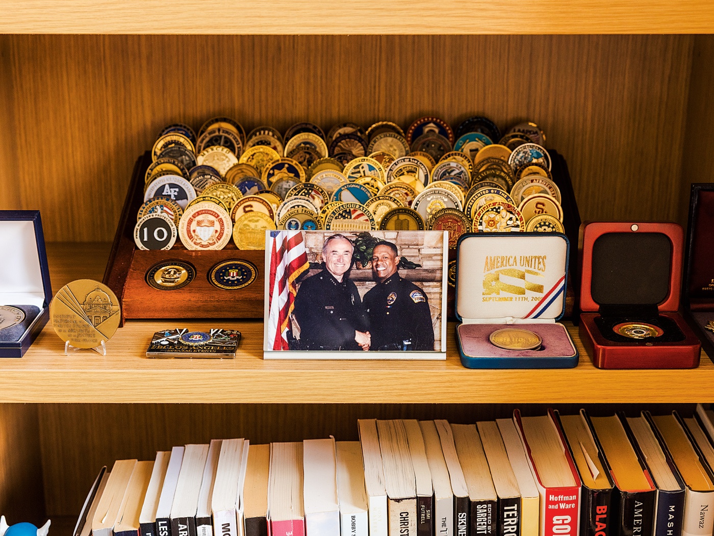 photo of shelf full of awards and honors in Erroll Southers' office